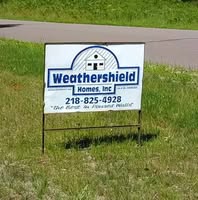 Weathershield Homes Inc sign on grass
