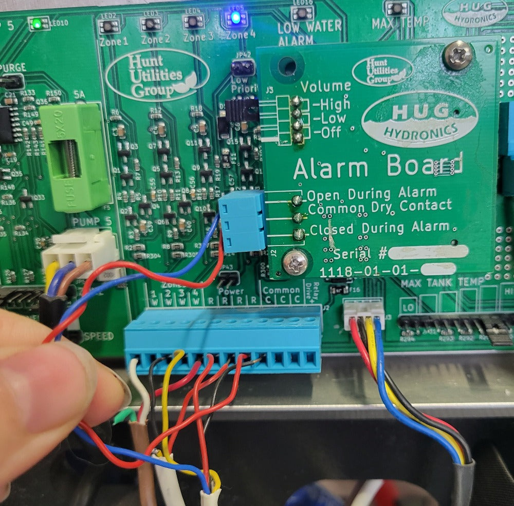The alarm board sits in the middle of the control board