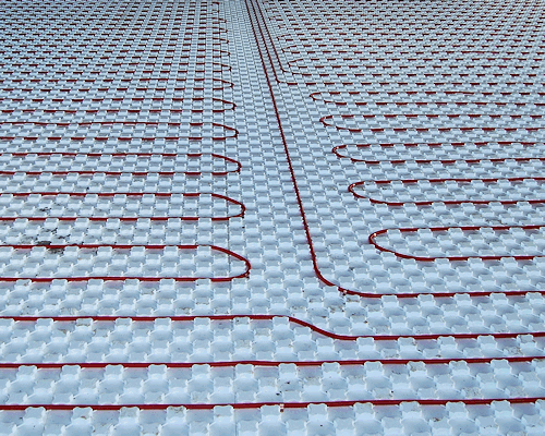 Heat sheet insulation hold your pex pipes in place. R 10 value sold. This picture shows a floor of installed heat-sheet with PEX pipes running in it.